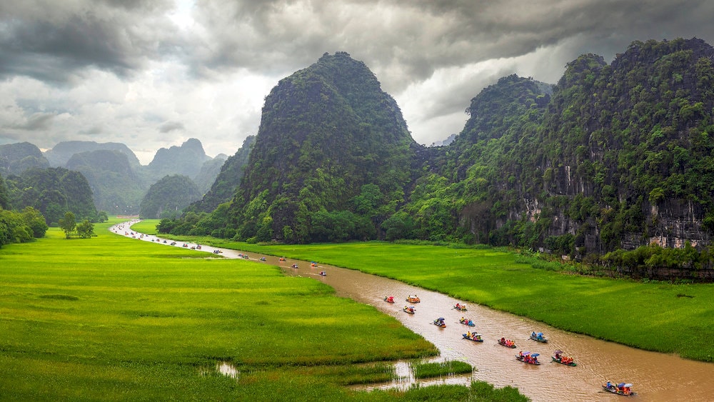 Trang An offers boat rides through limestone caves and lush valleys